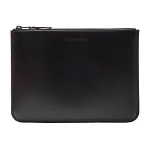 Chic Comme de Garçons leather clutch.